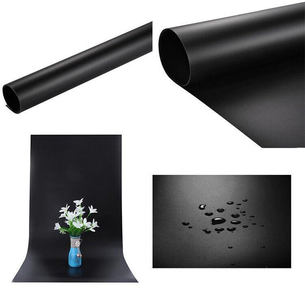 A roll of black PVC backdrop for product photography with a close-up of its texture and a section showing the material handling water droplets.