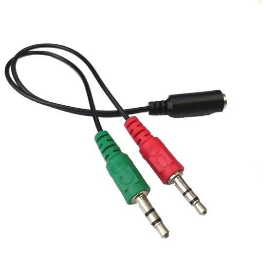 Audio cable with red and green plugs on a white background