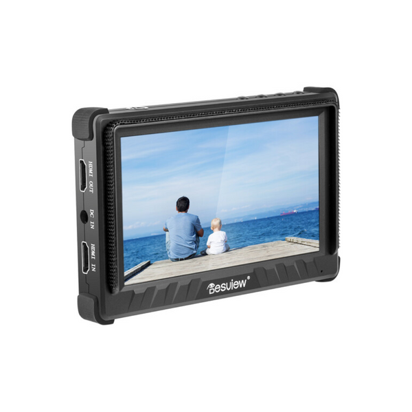 The image shows a Desview P5II 5.5" on-camera monitor displaying a scene of a person sitting on a bench by the sea with a child on their lap.