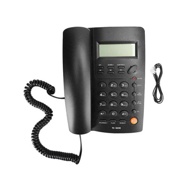 Black landline phone with coiled cord on a white background