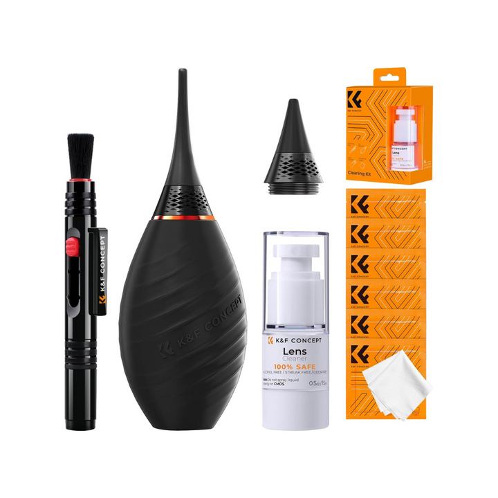 A collection of camera cleaning tools including an air blower, two nozzles, a cleaning cloth, a cleaning pen, and a bottle of cleaner, all laid out on a white background.