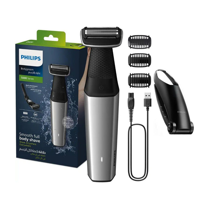 Philips Series 5000 Body Trimmer packaging and the body trimmer with three attachments, a USB cable, and a comb, displayed alongside the box which highlights the product's features.