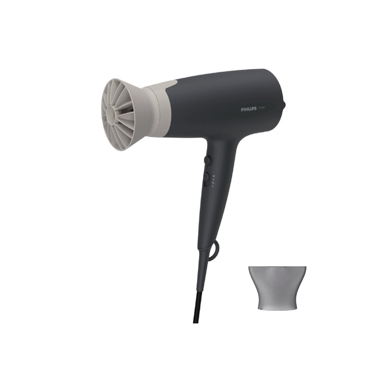 Black and gray hair dryer with nozzle attachment on a white background