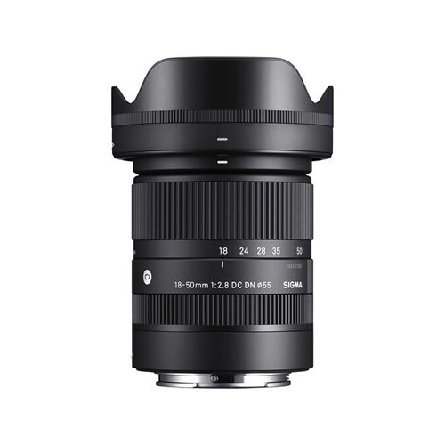 A Sigma 18-50mm f/2.8 DC DN Contemporary E-mount lens for Sony E-mount cameras, featuring a black cylindrical body with markings and a hood.