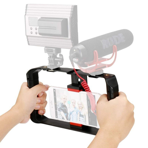 A smartphone mounted in a black cage with red accents, featuring dual handgrips and multiple mounting options.