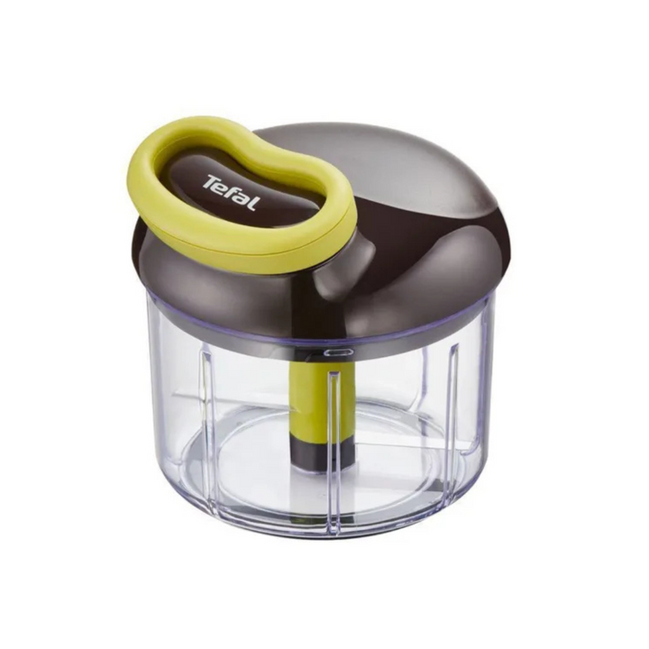 A Tefal manual chopper with a clear container and a black and green handle.